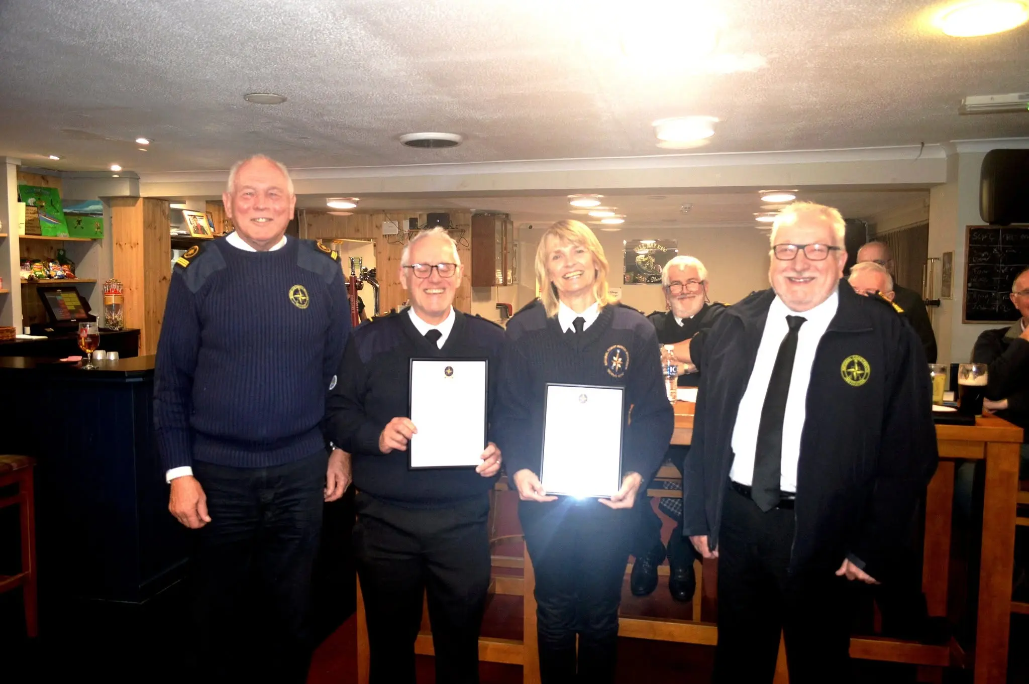 NCI Worms Head volunteers receiving a Certificate of Merit