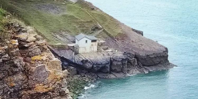 Kitchen Corner, a small historic building tucked into the cliffs on the Gower coast path near Rhosili