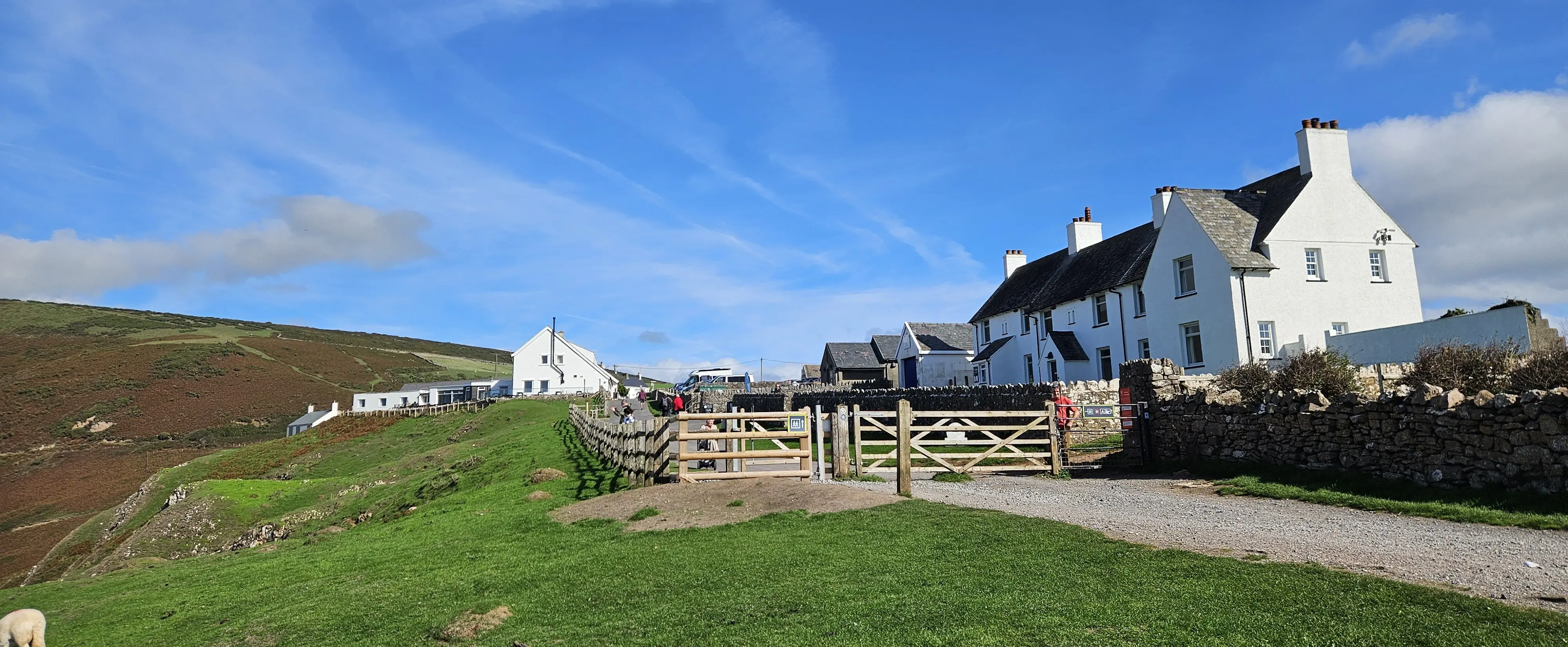 The gates at the end of Rhosili village where the coast path to Worms Head begins, beside the village's white-painted cottages