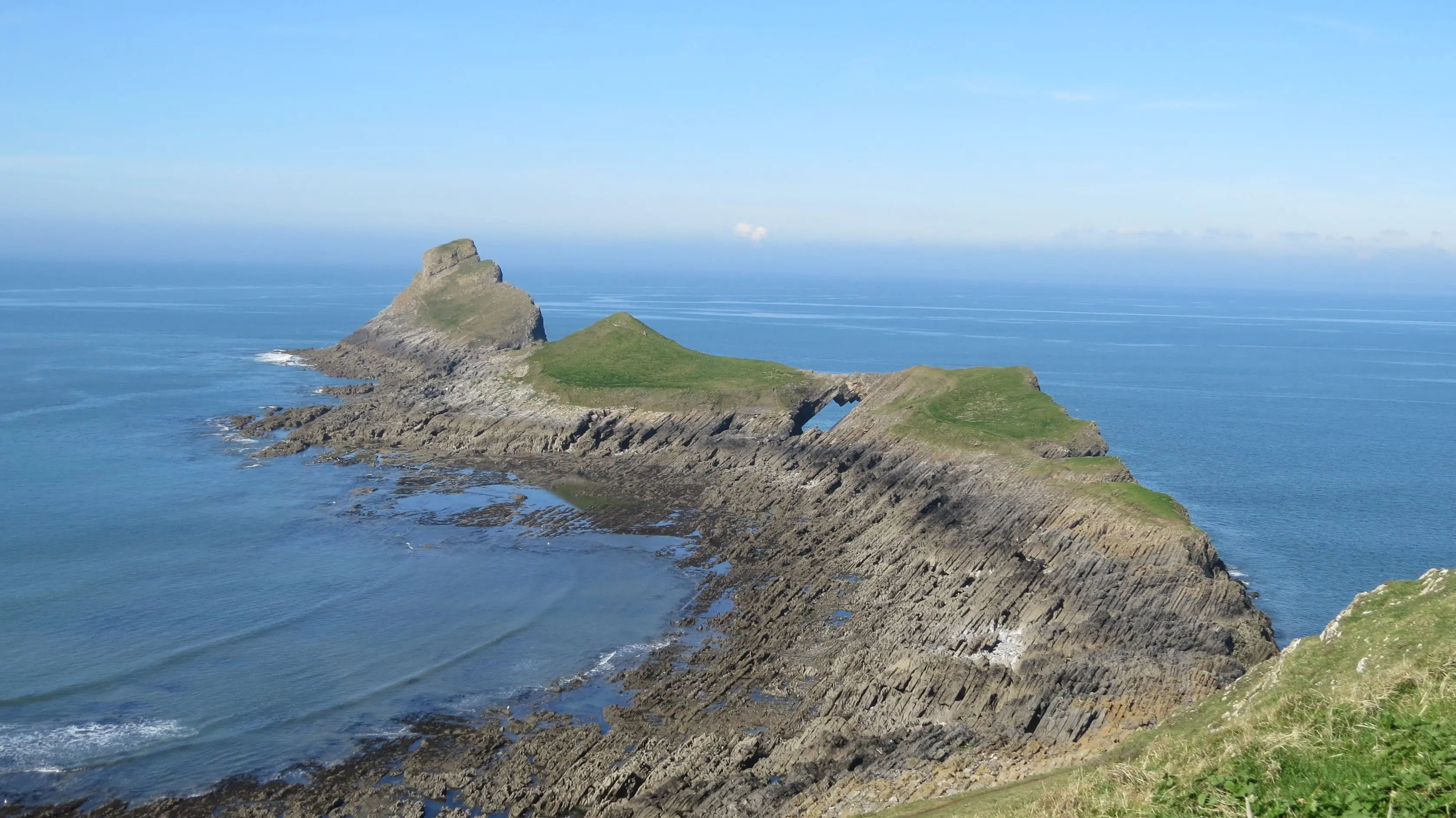 Worms Head promontory viewed from Inner Head, looking out towards Middle Head, Devil's Bridge, and Outer Head