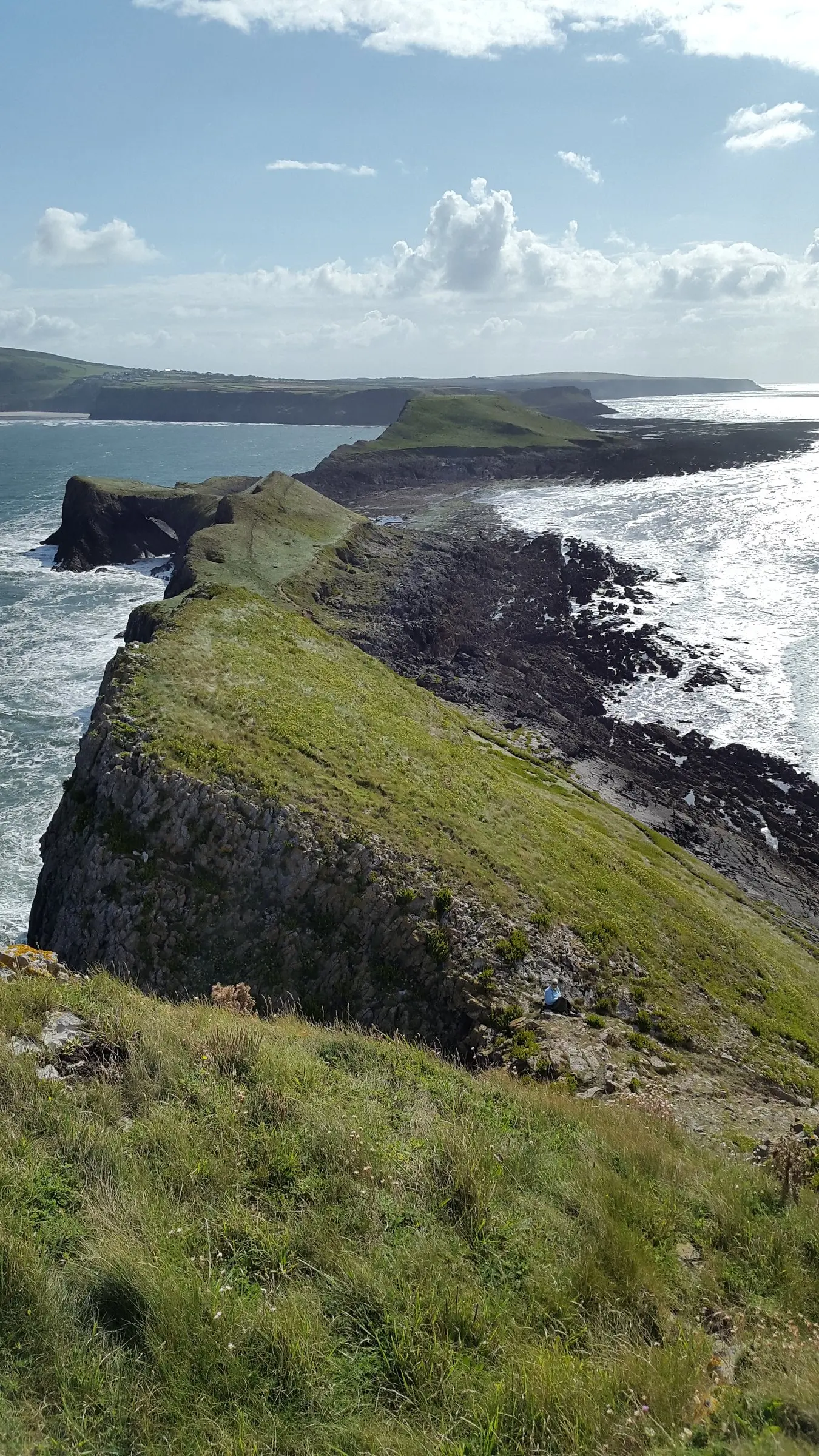 Looking back along the length of the Worm from the Outer Head, with Rhosili and the Gower coast beyond